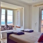 Master bedroom with balcony at Villa Acacia